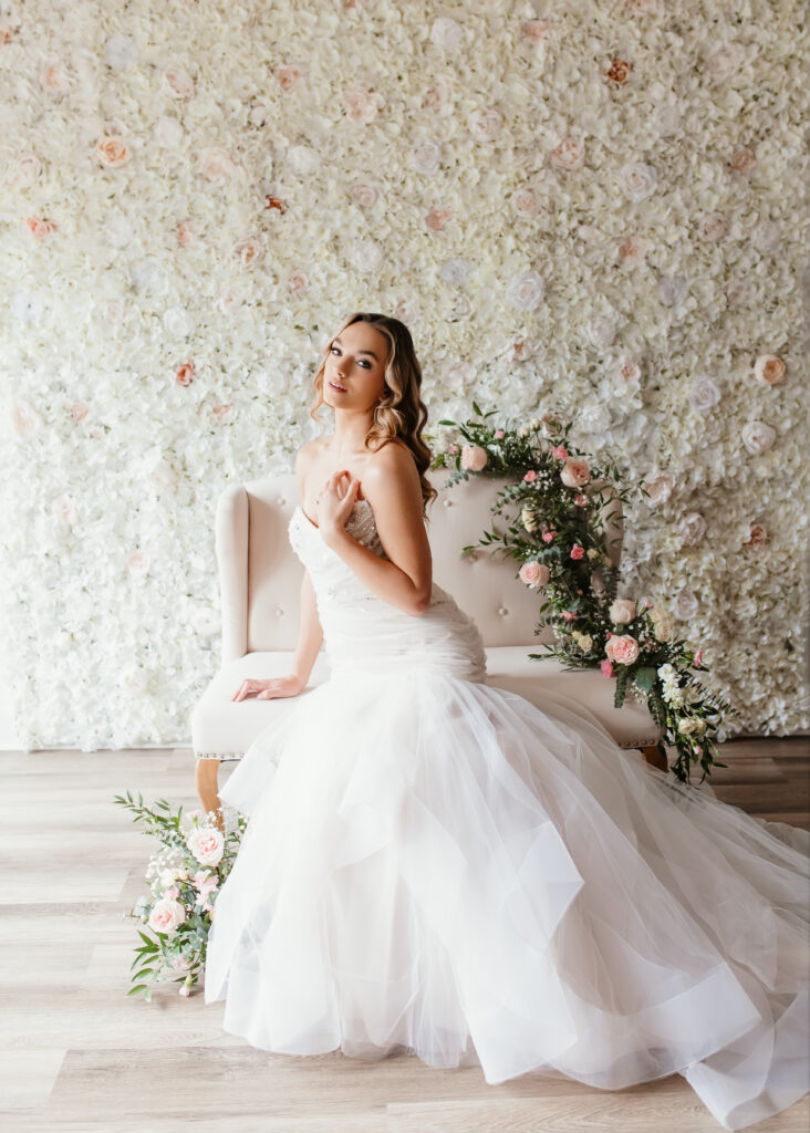 Beautiful bride is posing in front of floor wall for a bridal boudoir photoshoot in Richmond Virginia 