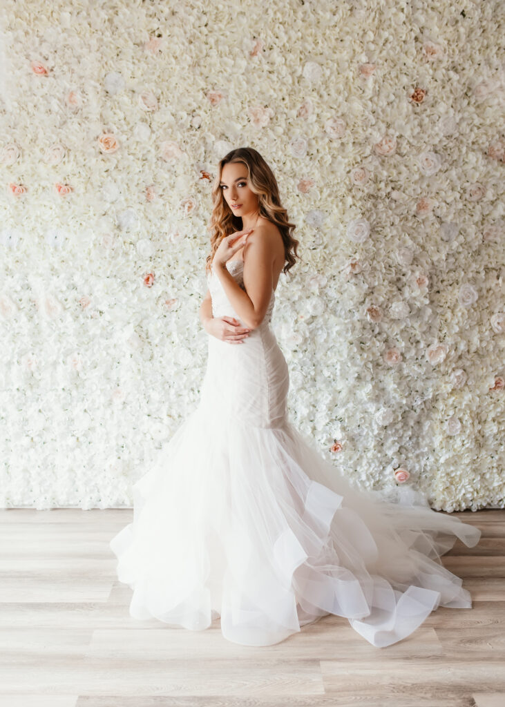 Beautiful bride is posing in front of floor wall for a bridal boudoir photoshoot in Richmond Virginia 