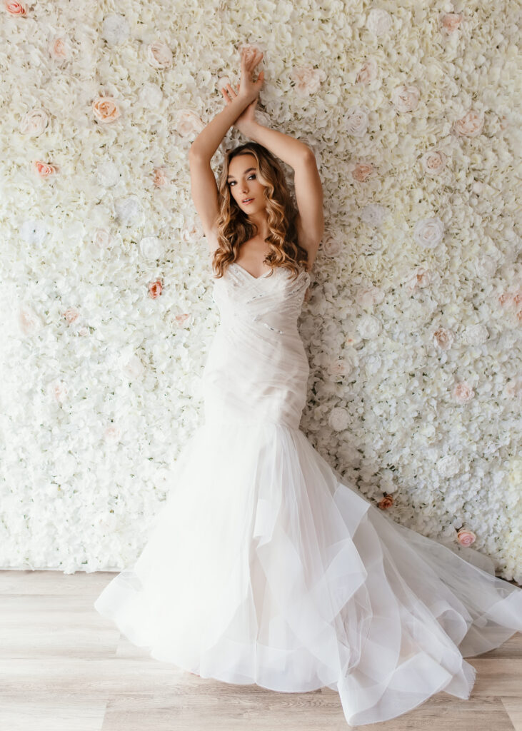 Beautiful bride is posing in front of floor wall for a bridal boudoir photoshoot in Richmond Virginia 