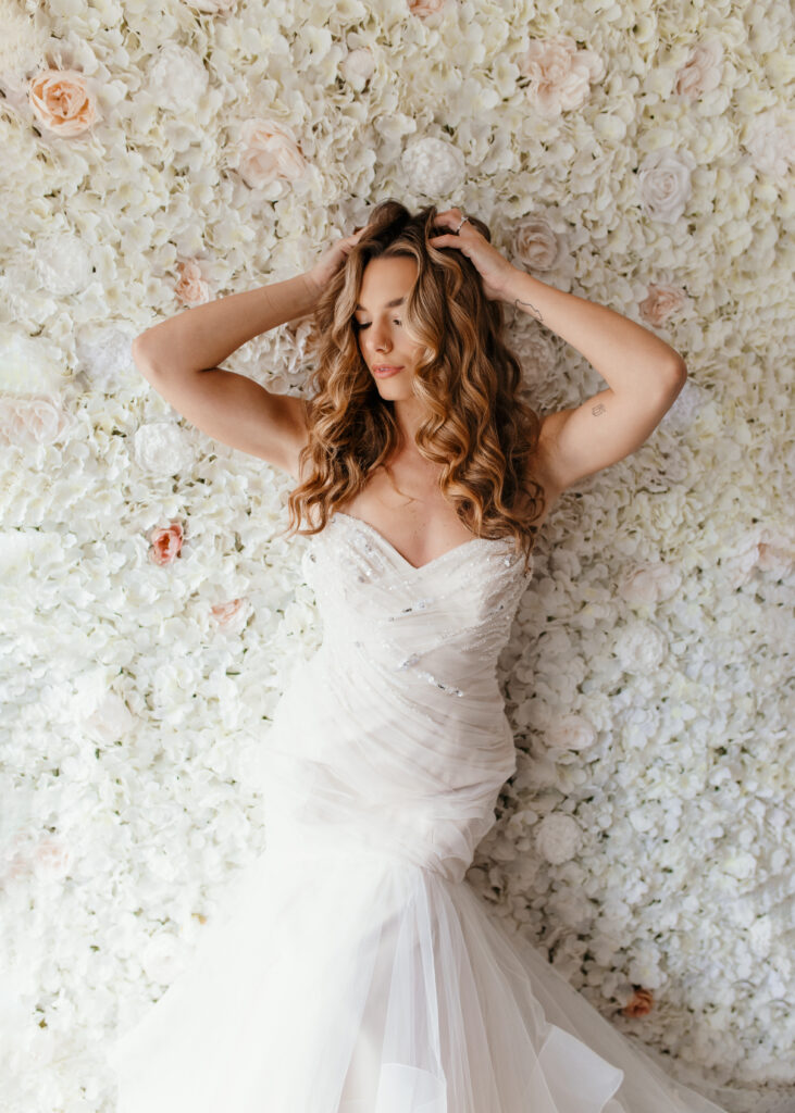 Beautiful bride is posing in front of floor wall for a bridal boudoir photoshoot in Richmond Virginia 