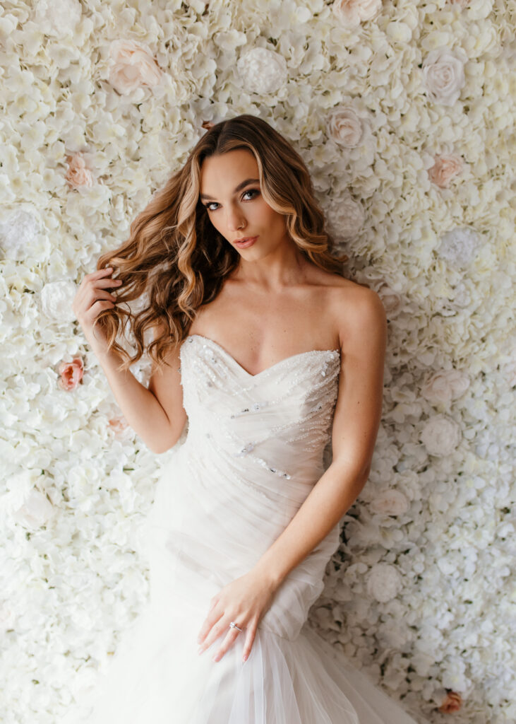 Beautiful bride is posing in front of floor wall for a bridal boudoir photoshoot in Richmond Virginia 