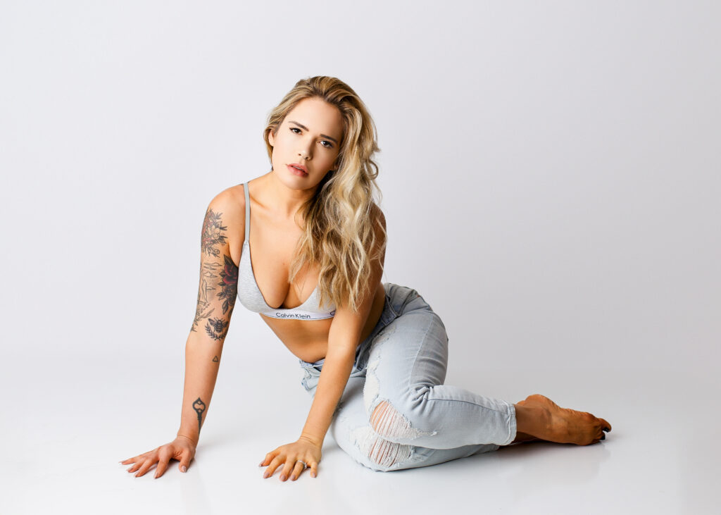 Woman posing in a simple boudoir look of barrette and jeans in Richmond, Virginia. 
